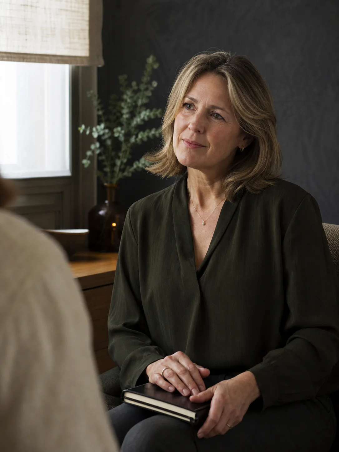 A woman in conversation during a health consultation.